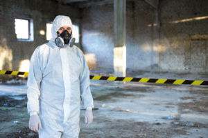 An adult male in a medical suit due to radiation.